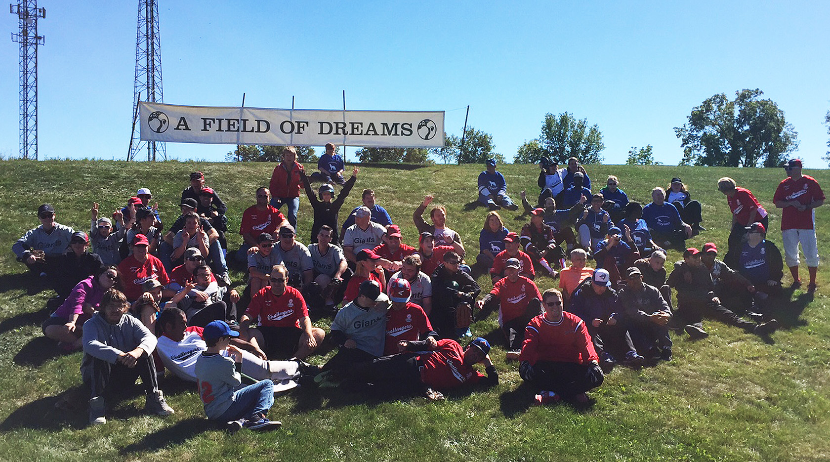Baseball Tournament Participants sitting on hillside