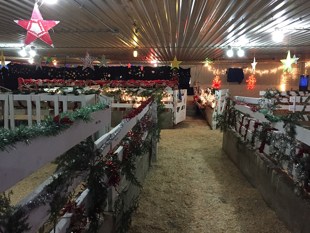 bright lights and garland decorate the barn