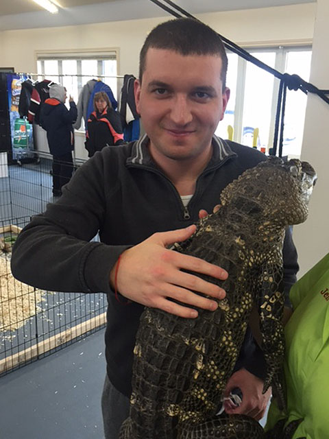 Man holding an alligator
